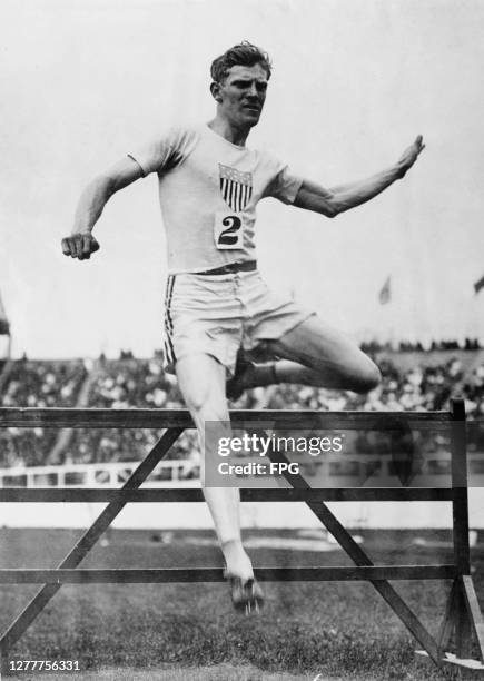 American athlete Charles Bacon wins the 400 metres hurdles at the 1908 Summer Olympics in London, UK.