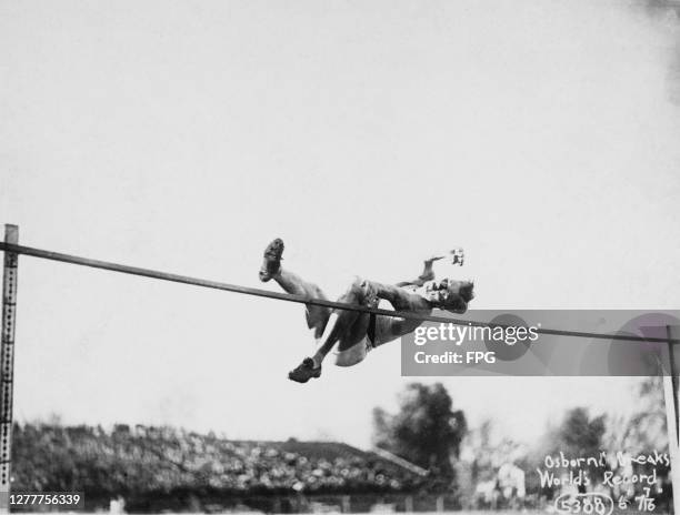 Athlete Harold Marion Osborn sets a new Olympic record of 6 feet 6 inches in the high jump at the 1924 Olympics in Paris, France.