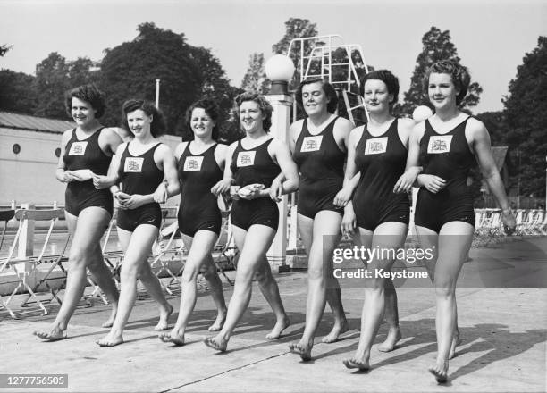 The British women's swimming team taking part in the 1948 Summer Olympics, the XIVth Olympiad in London, England, 1948. From left to right, they are...