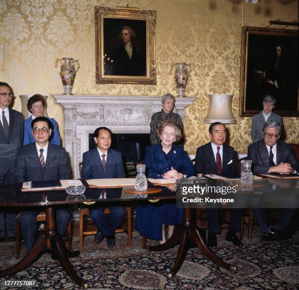 From left to right, Li Peng, Vice Premier of the People's Republic of China, Hu Yaobang, General Secretary of the Communist Party of China, British...