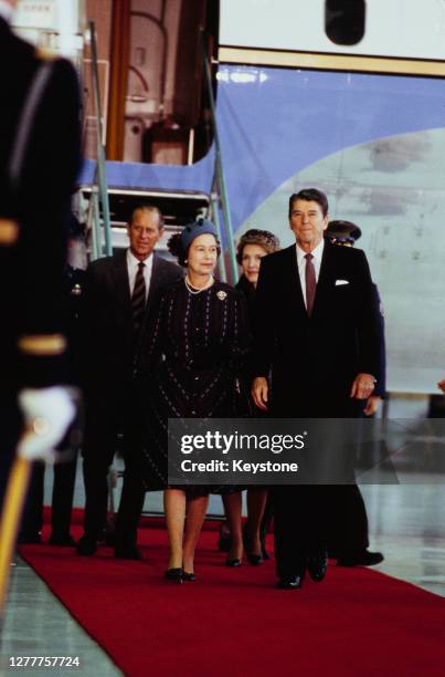 President Ronald Reagan and his wife Nancy greet Queen Elizabeth II and Prince Philip upon their arrival at Santa Barbara Airport in California, for...