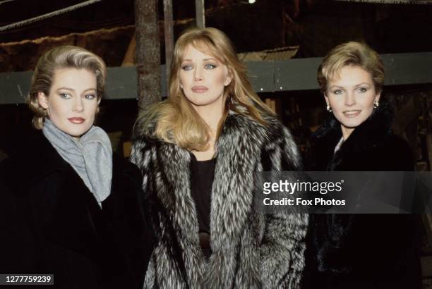 From left to right, actresses Alison Doody, Tanya Roberts and Fiona Fullerton pose at Pinewood Studios in England, to promote the new James Bond film...