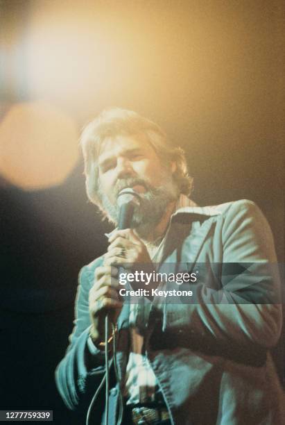 American singer and songwriter Kenny Rogers in concert, circa 1977.