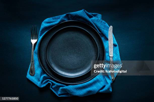black place setting shot from above on dark table - food photography dark background blue stock pictures, royalty-free photos & images