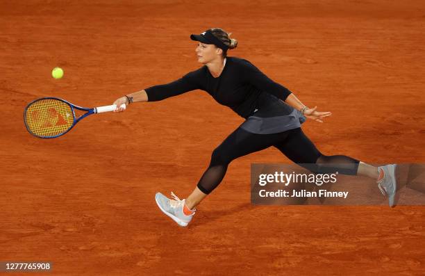 Ana Bogdan of Romania plays a forehand during her Women's Singles second round match against Sofia Kenin of The United States of America on day five...