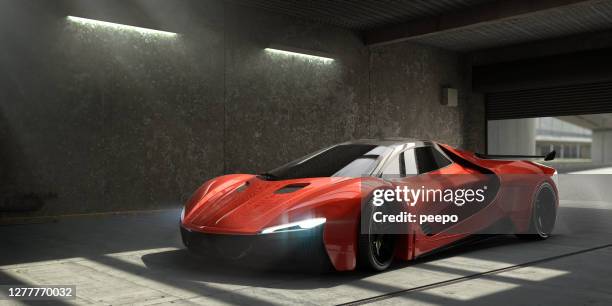 generisches red sports car parked in empty garage - sportwagen stock-fotos und bilder