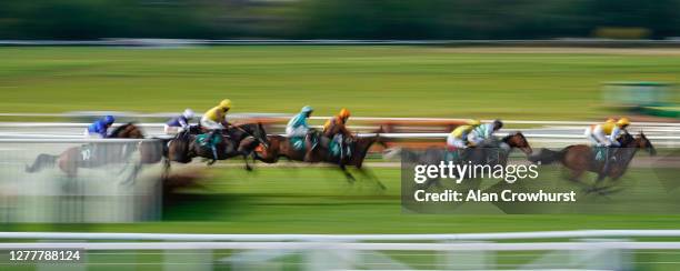 General view as runner clear a flight of hurdles during The Follow RacingTV On Twitter Mares' Handicap Hurdle at Warwick Racecourse on October 01,...