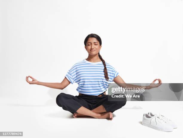 business woman in yoga position - lotus position stock pictures, royalty-free photos & images