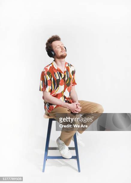 young man wearing headphones - headphones isolated foto e immagini stock
