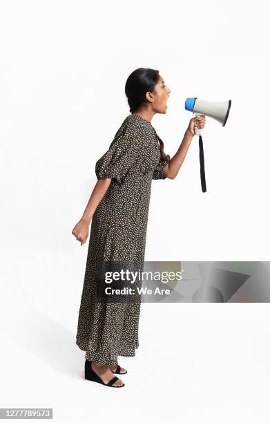 young woman shouting into megaphone - protestor portrait stock pictures, royalty-free photos & images