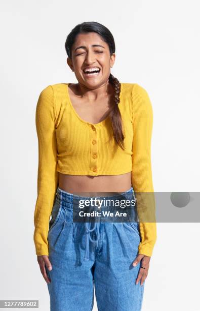 young woman laughing - embarrassment stock pictures, royalty-free photos & images