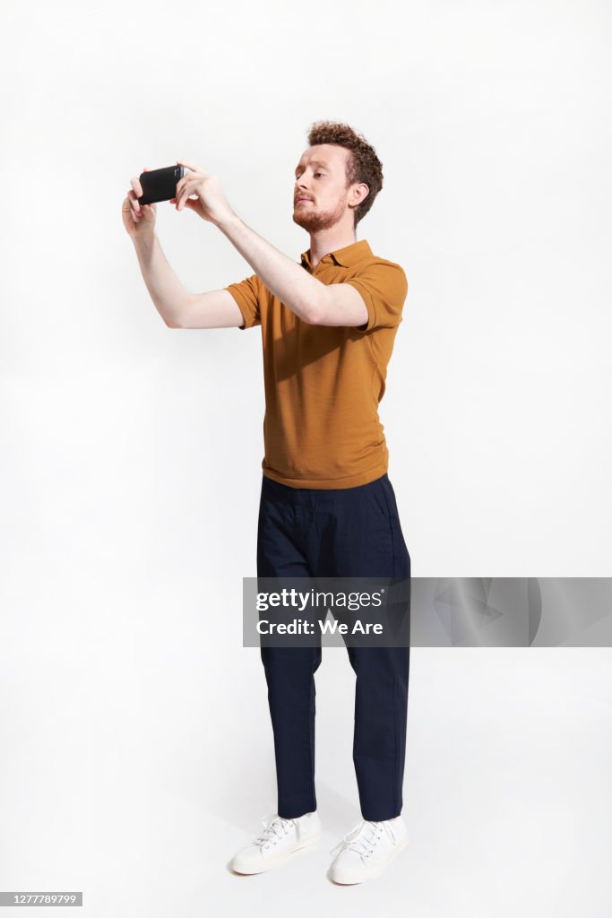 Man taking photo with smartphone