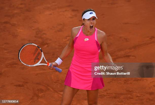 Alize Cornet of France celebrates after winning a point during her Women's Singles second round match against Shuai Zhang of China on day five of the...