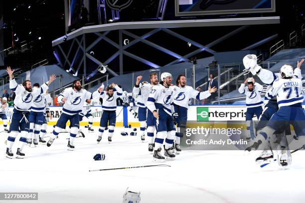 Goaltender Andrei Vasilevskiy of the Tampa Bay Lightning is mobbed by his teammates on the ice after they defeated the Dallas Stars 2-0 in Game Six...