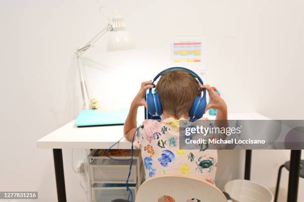 Student sits at a desk as 2nd and 3rd grade students attend class in person at an art gallery turned learning pod on October 01, 2020 in New York...