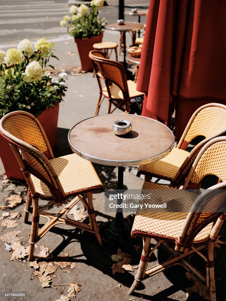 Table and chairs outside a cafe in Paris