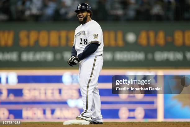 Prince Fielder of the Milwaukee Brewers reacts after hitting a double in the fourth inning against the Arizona Diamondbacks during Game One of the...