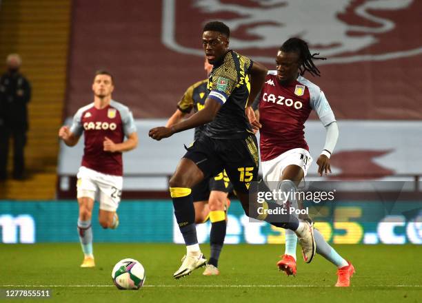Bruno Martins Indi of Stoke City battles for possession with Bertrand Traore of Aston Villa during the Carabao Cup fourth round match between Aston...