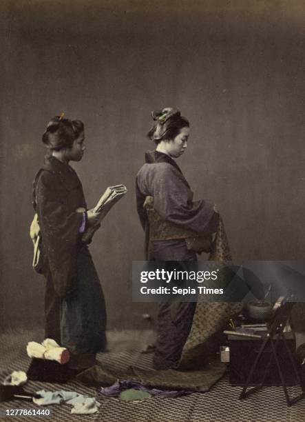 Putting on the Obi, or Girdle; Felice Beato ; Japan; 1866 - 1867; Hand-colored Albumen silver print.