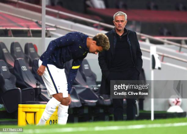 Jose Mourinho, Manager of Tottenham Hotspur looks on as Dele Alli of Tottenham Hotspur warms up at half time during the UEFA Europa League play-off...