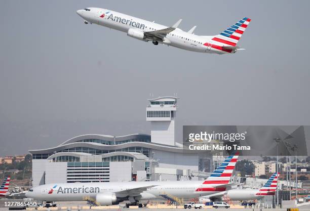 An American Airlines plane takes off from Los Angeles International Airport on October 1, 2020 in Los Angeles, California. United Airlines and...