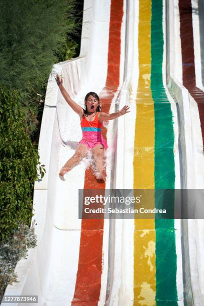 young girl having fun sliding in a waterpark, kusadasi,turkey all summer. - kusadasi stock pictures, royalty-free photos & images