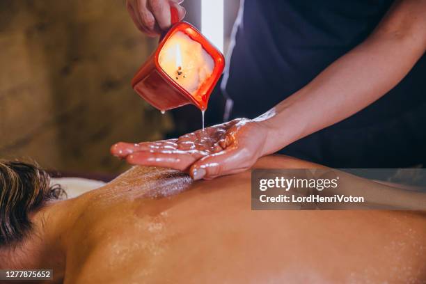 candle massage. - wax figure stock pictures, royalty-free photos & images