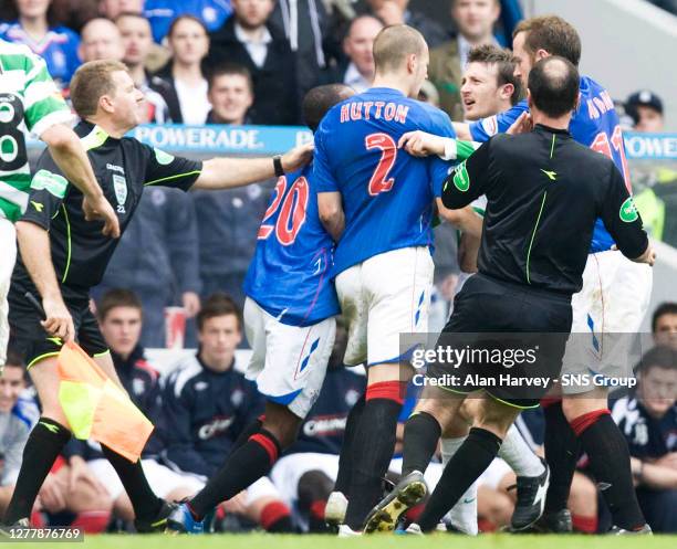 Tempers flare in the second half between Alan Hutton and Celtic defender Lee Naylor as the match officials race to intervene