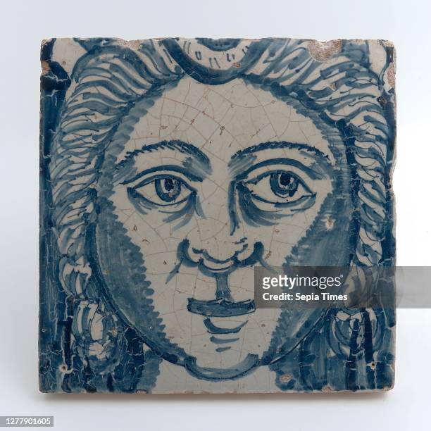 Tile of chimney pilaster, blue on white, head of woman with long curly hair, chimney pilaster tile pilaster footage fragment ceramics pottery glaze,...