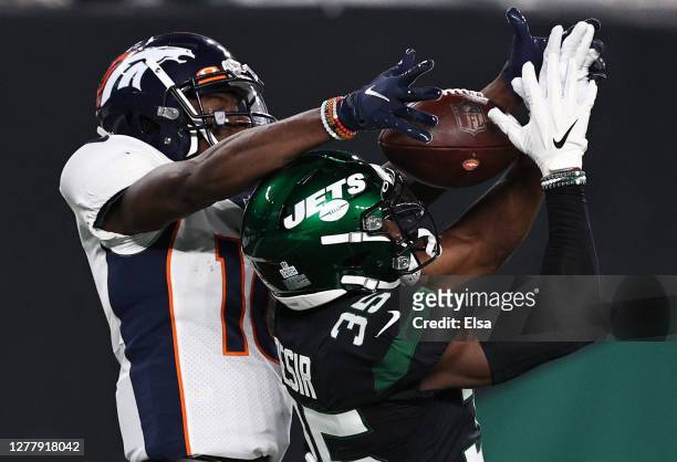Jerry Jeudy of the Denver Broncos catches a pass for a touchdown against Pierre Desir of the New York Jets during the second quarter at MetLife...