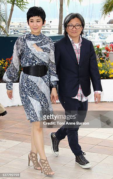 Actress Sandra Ng Kwan Yu and director Peter Chan attend the "Wu Xia" Photocall during the 64th Annual Cannes Film Festival at Palais des Festivals...