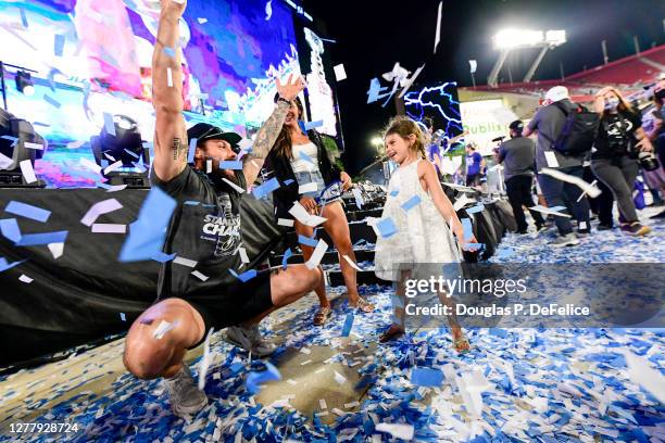 Zach Bogosian of the Tampa Bay Lightning throws confetti with his daughter during the 2020 Stanley Cup Champion rally on September 30, 2020 in Tampa,...