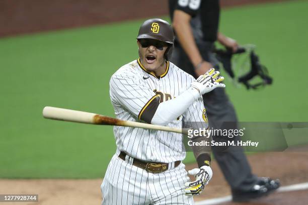 Manny Machado of the San Diego Padres reacts after hitting a solo homerun during the sixth inning of Game Two of the National League Wild Card Series...
