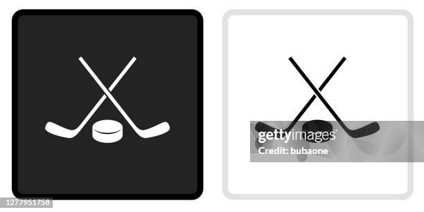 hockey stick and puck icon on  black button with white rollover - hockey stick and puck stock illustrations