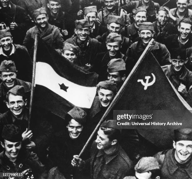 Liberation of Belgrade, October 1944. Jubilant Russian troops and Yugoslav partisans mingle on the streets of Belgrade. The photographer is unknown.