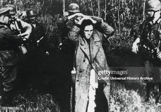 German soldiers with Russian prisoners, Russia, 1941. Operation Barbarossa, the German invasion of the Soviet Union, was launched on 22 June 1941. As...