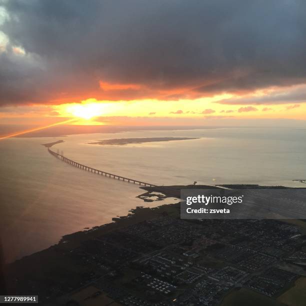 aerial view over copenhagen at sunset with oeresund bridge - oresund region bildbanksfoton och bilder