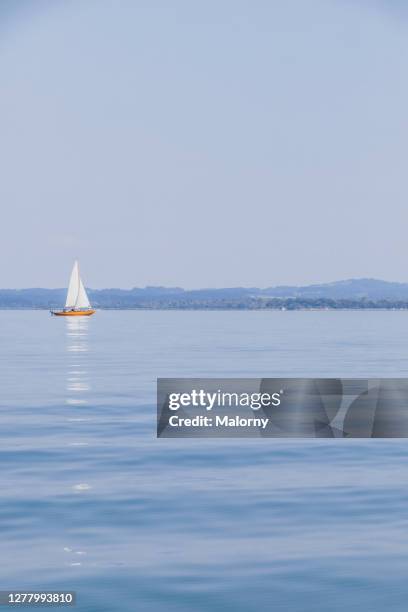 sailing boat sailing on lake chiemsee - boat deck background stock pictures, royalty-free photos & images