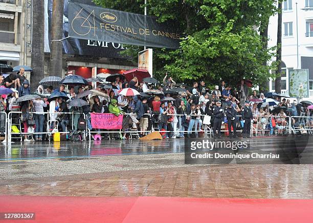 General view of fans waiting in the rain ahead of the "Pirates of the Caribbean: On Stranger Tides" Premiere during the 64th Annual Cannes Film...