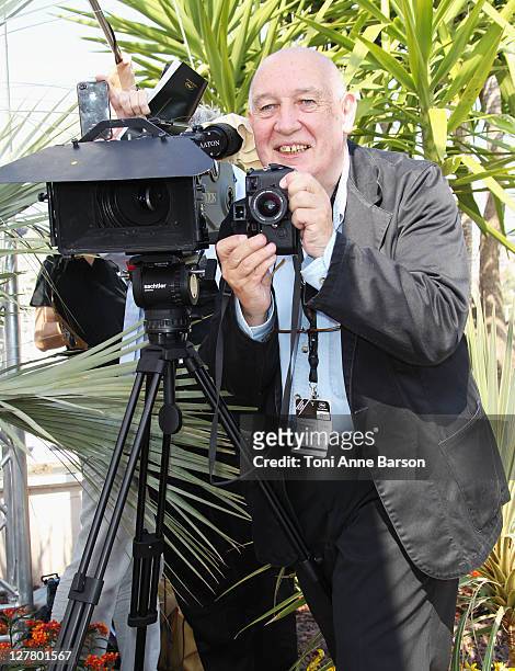 Photographer/filmmaker Raymond Depardon films the "We Need To Talk About Kevin" Photocall at the Palais des Festivals during the 64th Cannes Film...