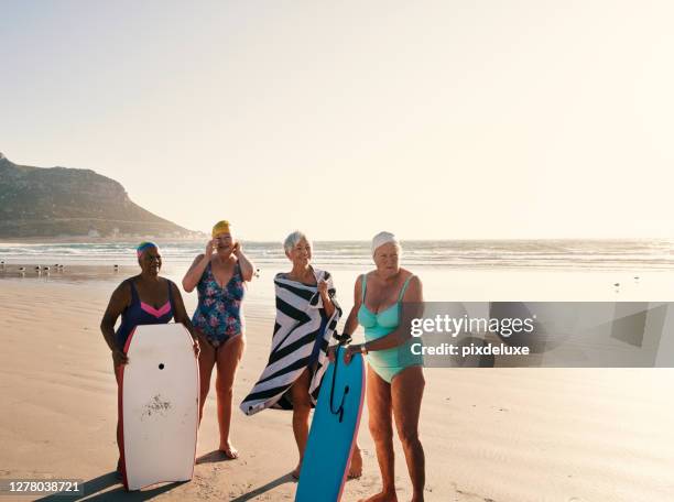 life's just better in the company of friends - mature surfers stock pictures, royalty-free photos & images