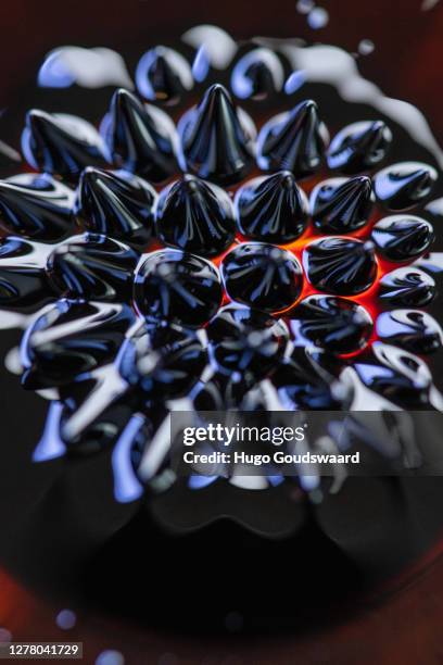 macro close-up of ferrofluid. - ferrofluid stock pictures, royalty-free photos & images