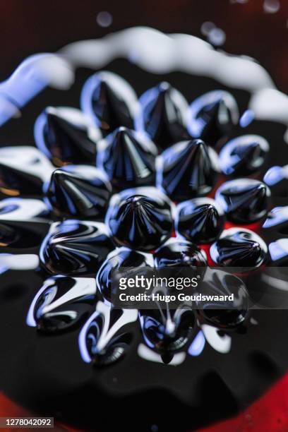 macro close-up of ferrofluid. - ferrofluid stock pictures, royalty-free photos & images