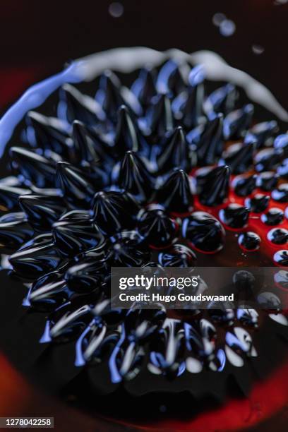 macro close-up of ferrofluid. - ferrofluid stock pictures, royalty-free photos & images