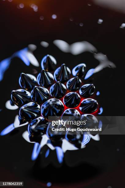 macro close-up of ferrofluid. - ferrofluid stock pictures, royalty-free photos & images