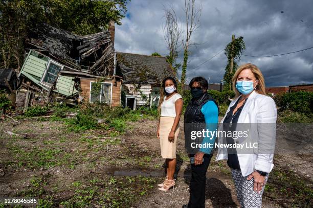 Town Board member Joan Cergol, right, with Irene Moore, and Jennifer Leveque both of Huntington, New York, standing in front of former slave Peter...