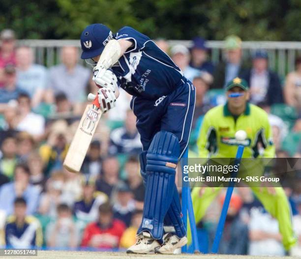 Scotland's Neil MacRae loses his wicket after facing only 15 balls; scoring 2 runs