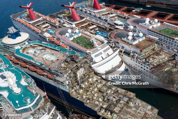 In this aerial view from a drone, five luxury cruise ships are seen being broken down for scrap metal at the Aliaga ship recycling port on October...