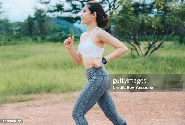 https://media.gettyimages.com/id/1278066164/photo/side-view-of-happiness-runner-woman-doing-workout-by-running-on-dirt-road.jpg?s=612x612&w=gi&k=20&c=97SJpzu0ML1U9Wic24SW2vQXXdiQ5y_fgwmtFlYXPiE=