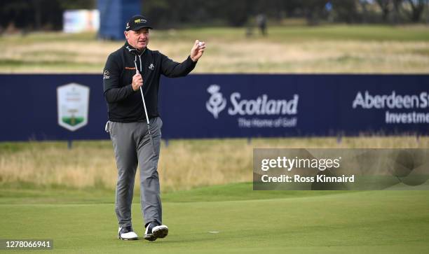 Paul Lawrie of Scotland acknowledges the crowd on the 18th green after completing his final ever round on the European Tour during the second round...